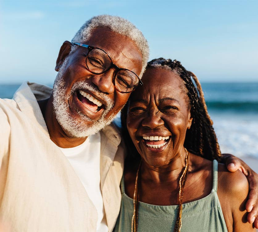 smiling seniors at beach
